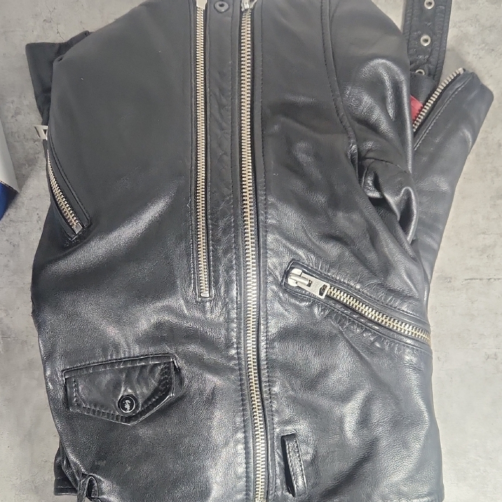 Black Leather Jacket with Zipper Details